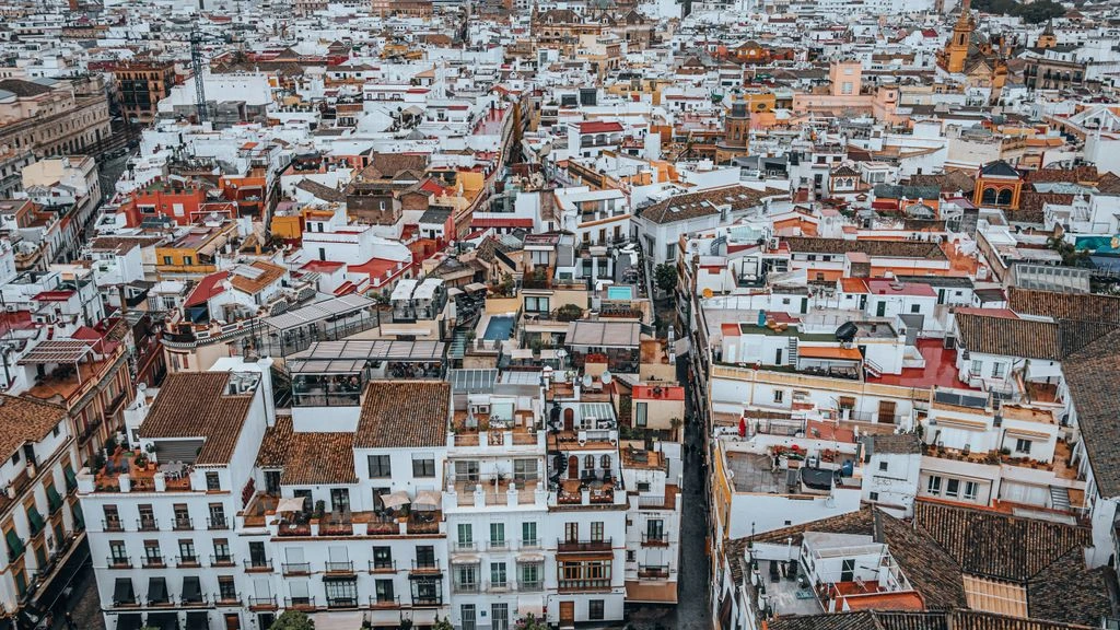 The Seville skyline at dusk as seen from the Triana bank of the Guadalquivir.